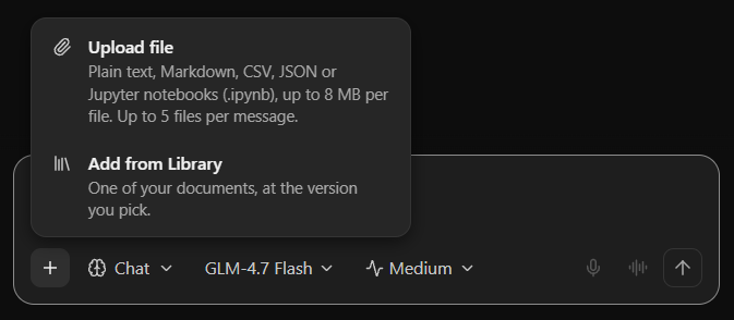 The attach menu open in a chat: Upload file (plain text, Markdown, CSV, JSON or Jupyter notebooks, up to 8 MB per file, up to 5 files per message) and Add from Library.